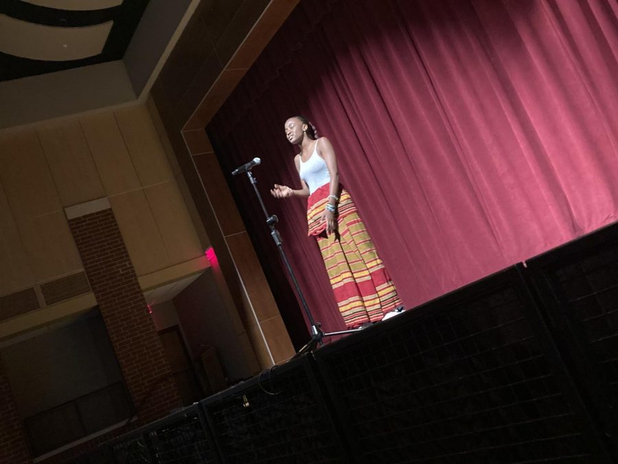 Student performing a song from Uganda. 