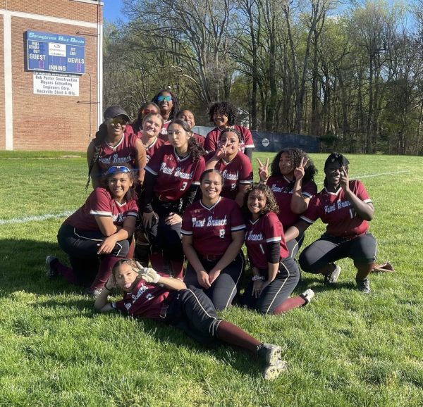 The softball team celebrates after beating rival Springbrook earlier this season. 