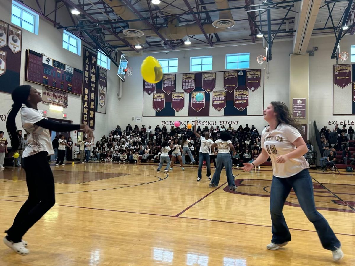 The first part of the Balloon Relay Race, which 2 people had to pass the volleyball back and forth volleyball style.