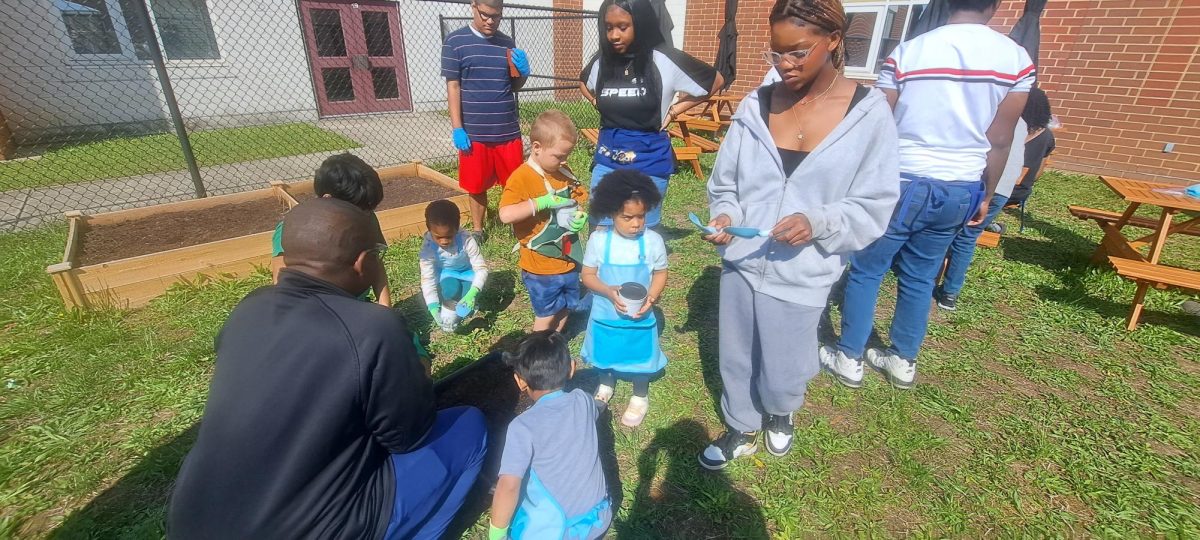 Kids visited the greenhouse, planted seeds, and watered them
