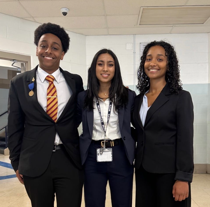 The newly elected Student Member of the Board of Education (SMOB), Leul Dawit, stands with Anuva Maloo (current SMOB), and Reemey Ghermay.